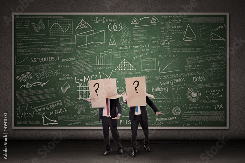Photo: Business people and question mark Business people and question mark