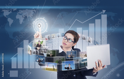 Photo: Businesswoman surrounds with digital media Businesswoman surrounds with digital media
