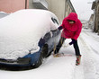 Real woman driver wrestles with snow chains