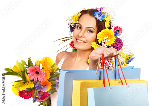 Photo: Woman with shopping bag holding flower. Woman with shopping bag holding flower.