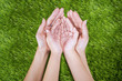 Open hand of mother and child outdoor