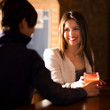 Couple of friends having a round of drinks