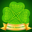 Green plastic ornate clover with golden ribbon banner