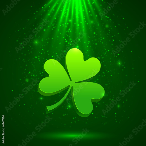 Vector: Green clover in the magic light background Green clover in the magic light background