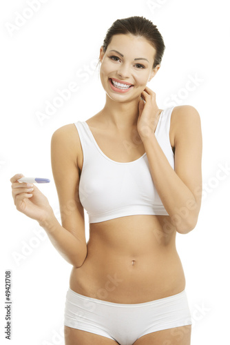 Photo: Pregnancy test - happy surprised woman Pregnancy test - happy surprised woman