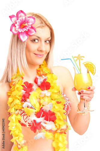 Photo: A smiling blond woman dressed in traditional costume drinking co A smiling blond woman dressed in traditional costume drinking co