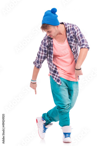 Photo: dancer pointing & looking at his shoes dancer pointing & looking at his shoes