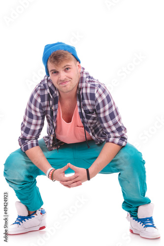 Photo: in crouched pose, hands together in crouched pose, hands together