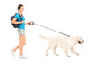 Photo: Full length portrait of a female student walking her dog Full length portrait of a female student walking her dog