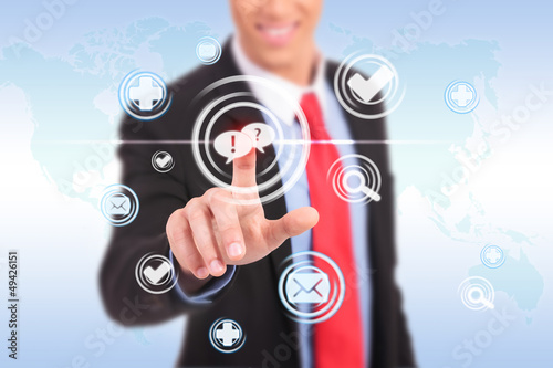 Photo: business man pushing a chat button business man pushing a chat button