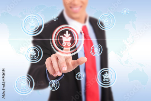 Photo: business man push shopping button business man push shopping button