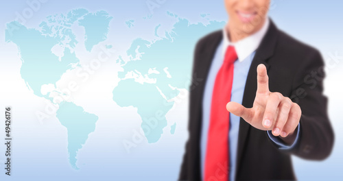 Photo: businessman pushing an imaginary button businessman pushing an imaginary button