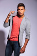 young man pulling on his jacket