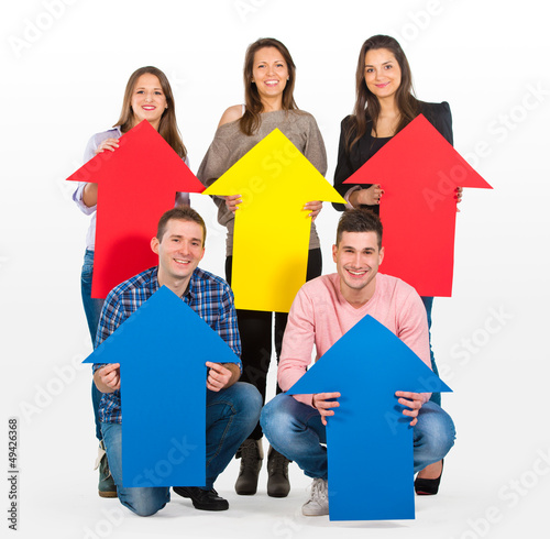 Photo: Group of people holding arrows pointing up Group of people holding arrows pointing up