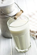 glass of milk on wooden table