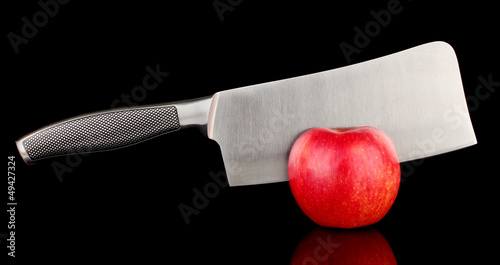 Photo: Red apple and knife on isolated on black Red apple and knife on isolated on black