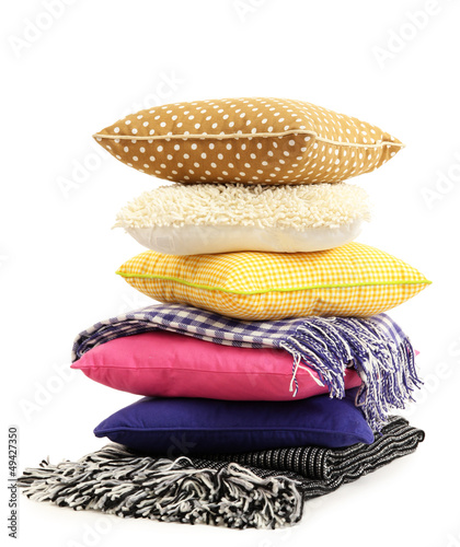 Photo: Hill colorful pillows and plaids isolated on white Hill colorful pillows and plaids isolated on white