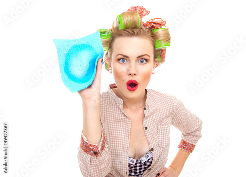 Photo: surprised housewife holding rag surprised housewife holding rag