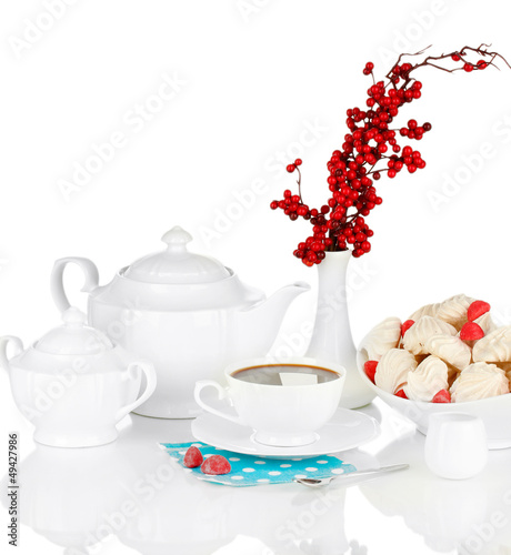 Photo: Beautiful white dinner service with an air meringues isolated Beautiful white dinner service with an air meringues isolated
