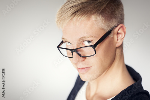 Photo: Close up of attractive man wearing glasses. Close up of attractive man wearing glasses.