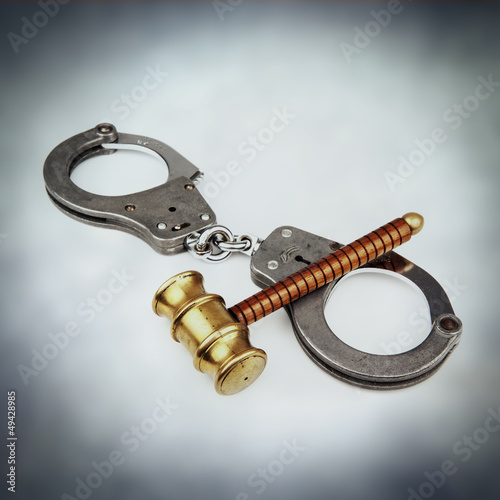 Photo: handcuffs gavel handcuffs gavel