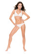 Young woman with lingerie (bikini) in front of white background