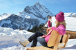 Girl with a camera in the Swiss Alps