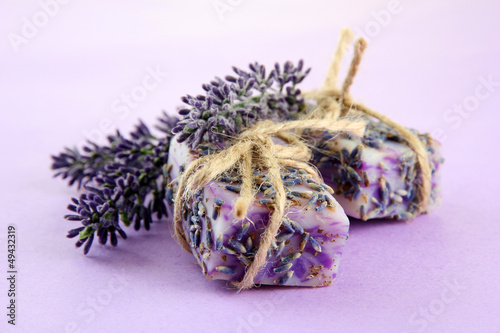 Photo: Natural handmade soap, on purple background Natural handmade soap, on purple background
