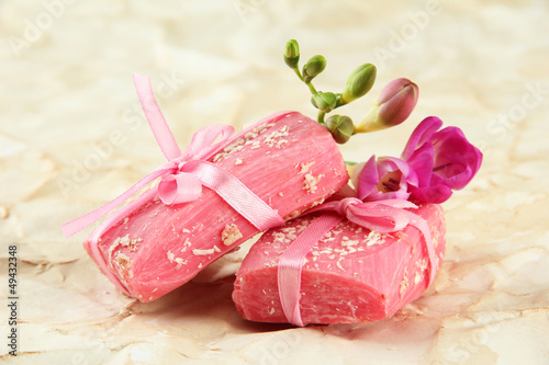 Photo: Natural handmade soap, on beige background Natural handmade soap, on beige background