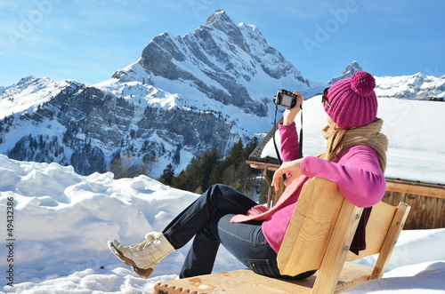 Photo: Girl with a camera in the Swiss Alps Girl with a camera in the Swiss Alps