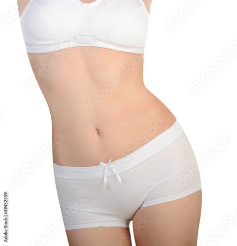 Photo: Slim woman body isolated on white background Slim woman body isolated on white background