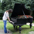 woman playing on an old piano,