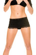 Part of a woman with black lingerie in front of white background