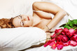 Beautiful slepping woman with red roses