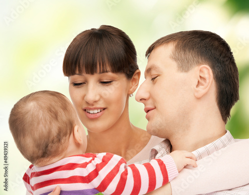 Photo: happy mother and father with adorable baby happy mother and father with adorable baby