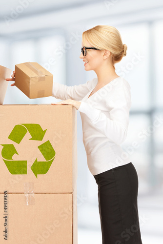 Photo: attractive businesswoman with big boxes attractive businesswoman with big boxes