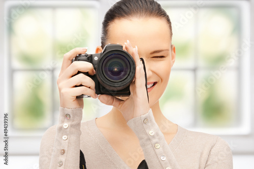 Photo: teenage girl with digital camera teenage girl with digital camera