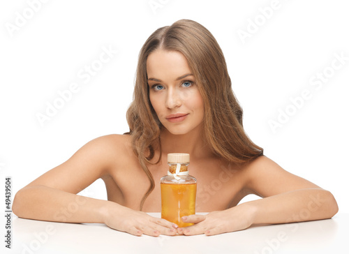 Photo: woman with oil bottle woman with oil bottle