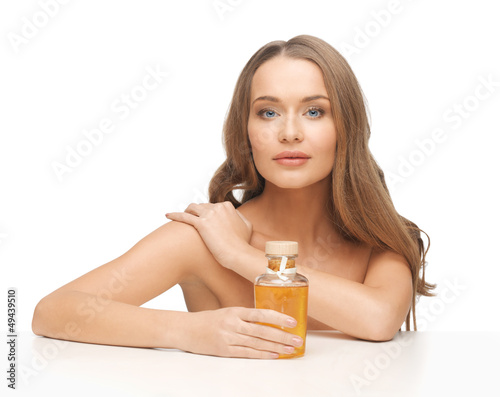 Photo: woman with oil bottle woman with oil bottle
