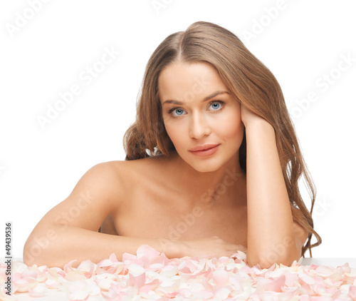 Photo: beautiful woman with rose petals beautiful woman with rose petals