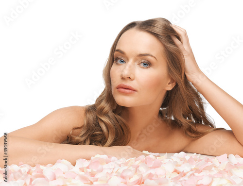 Photo: beautiful woman with rose petals beautiful woman with rose petals