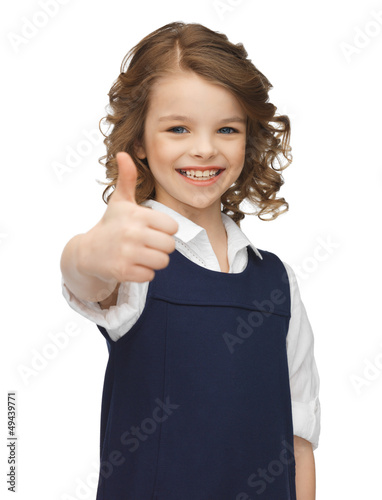 Photo: pre-teen girl showing thumbs up pre-teen girl showing thumbs up