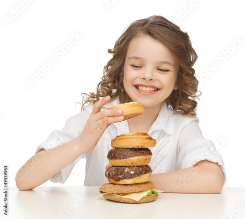 Photo: girl with junk food girl with junk food