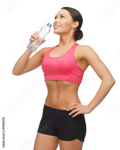Photo : woman with bottle of water woman with bottle of water