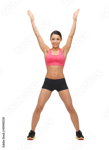 Photo: beautiful sporty woman doing exercise beautiful sporty woman doing exercise