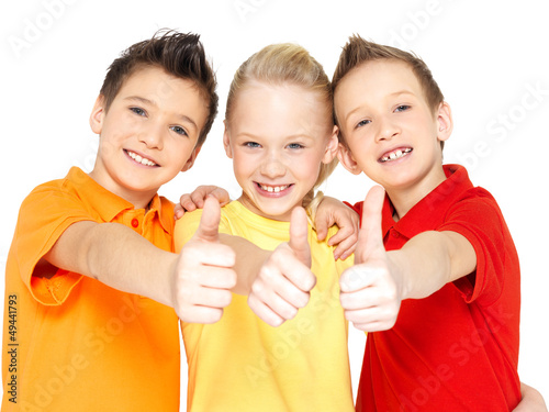 Photo: happy children with thumbs up gesture happy children with thumbs up gesture