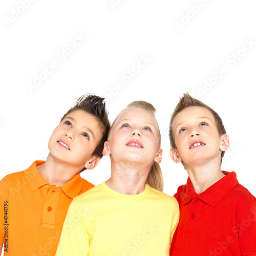 Photo: Portrait of the happy children looking up Portrait of the happy children looking up