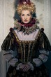 Haughty queen in royal dress