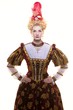 Haughty queen in royal dress isolated on white