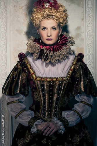 Photo: Haughty queen in royal dress Haughty queen in royal dress